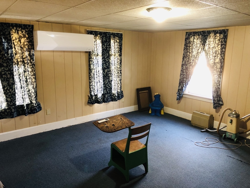 441 Main Street Hardwick, MA 01031 - Photo 22 of 26 a living room with furniture and a window