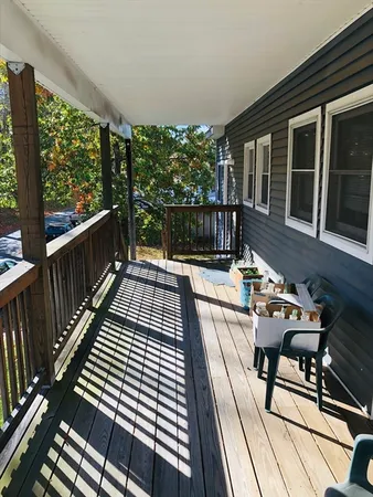 a view of balcony with wooden floor