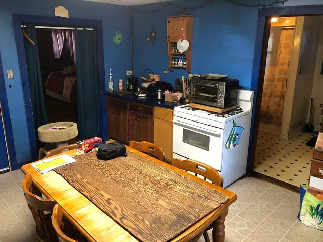 a bedroom with a bed and a fireplace