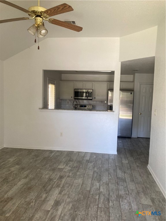 4601 John David Drive Killeen, TX 76549 - Photo 8 of 11 an empty room with a fireplace and ceiling fan