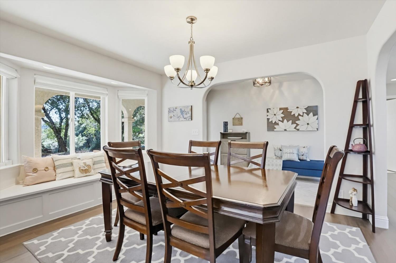18639 Fay Ridge Court Grass Valley, CA 95949 - Photo 18 of 99 a view of a dining room with furniture a chandelier and wooden floor