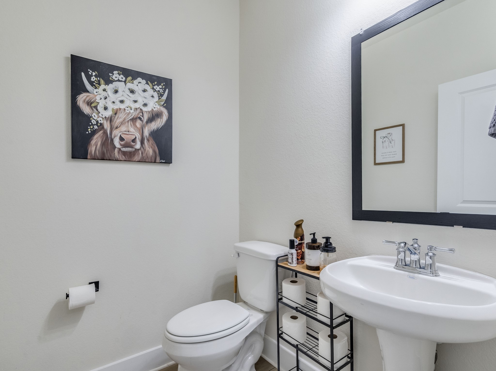 297 Tree Nut Loop Buda, TX 78610 - Photo 12 of 25 Half bath for guests downstairs