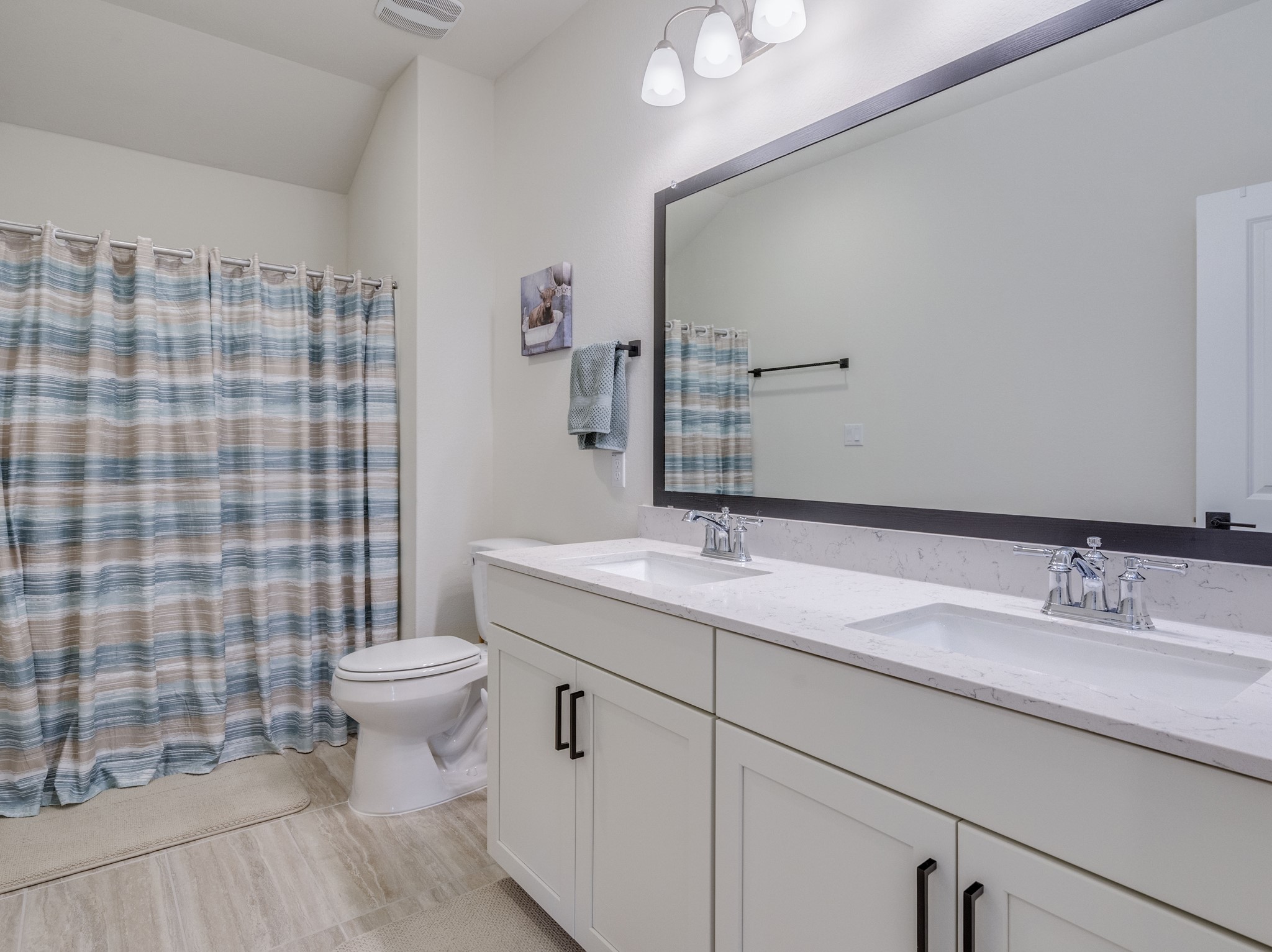 297 Tree Nut Loop Buda, TX 78610 - Photo 19 of 25 Full bathroom upstairs dual vanity and again beautiful cabinetry
