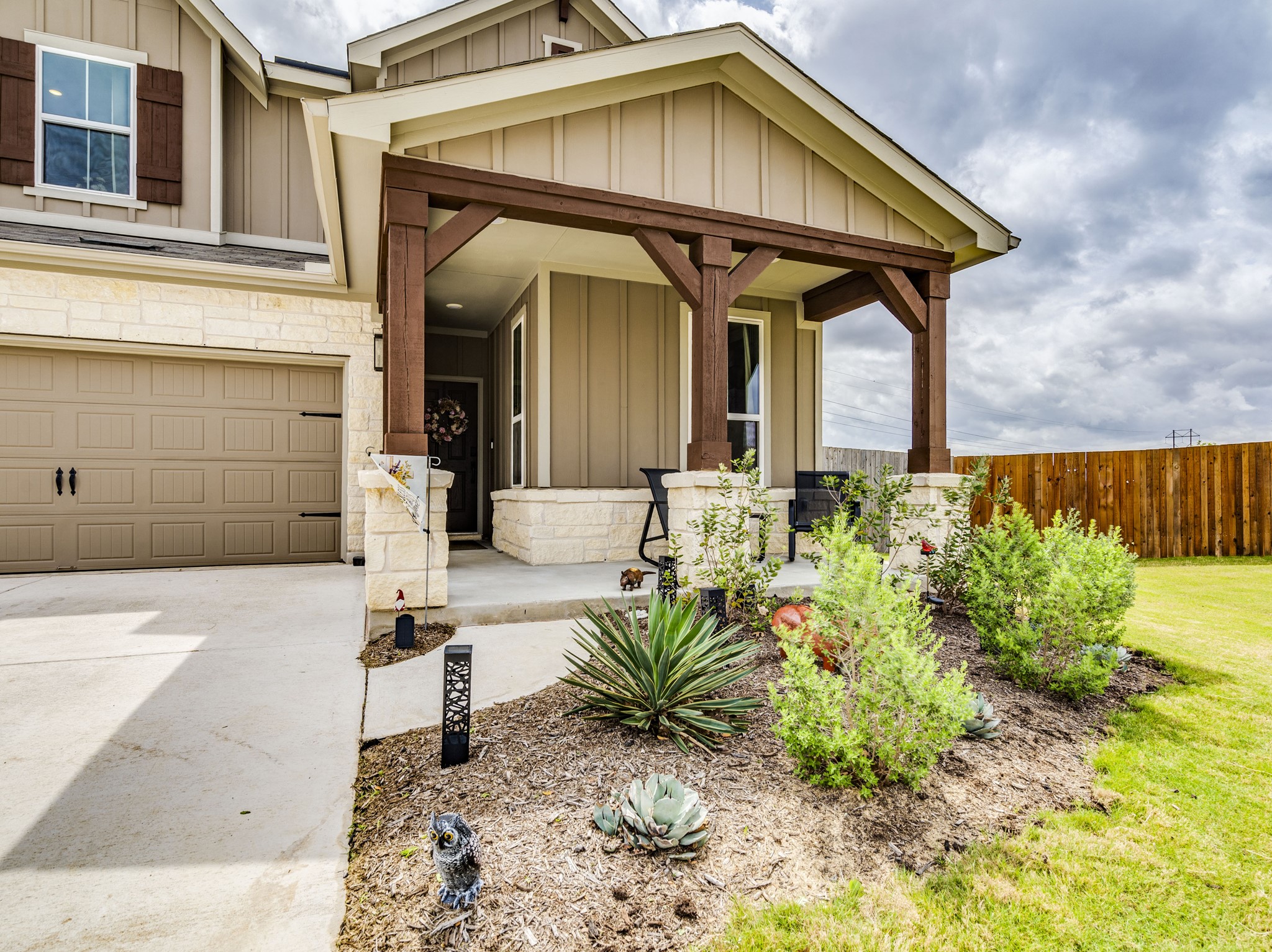 297 Tree Nut Loop Buda, TX 78610 - Photo 2 of 25 Are you imagining your office or 4th bedroom there privately tucked away under the front patio
