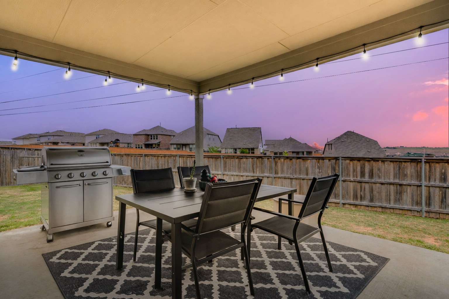 297 Tree Nut Loop Buda, TX 78610 - Photo 23 of 25 Bistro lights, bring your grill and let summer nights take the edge off life!