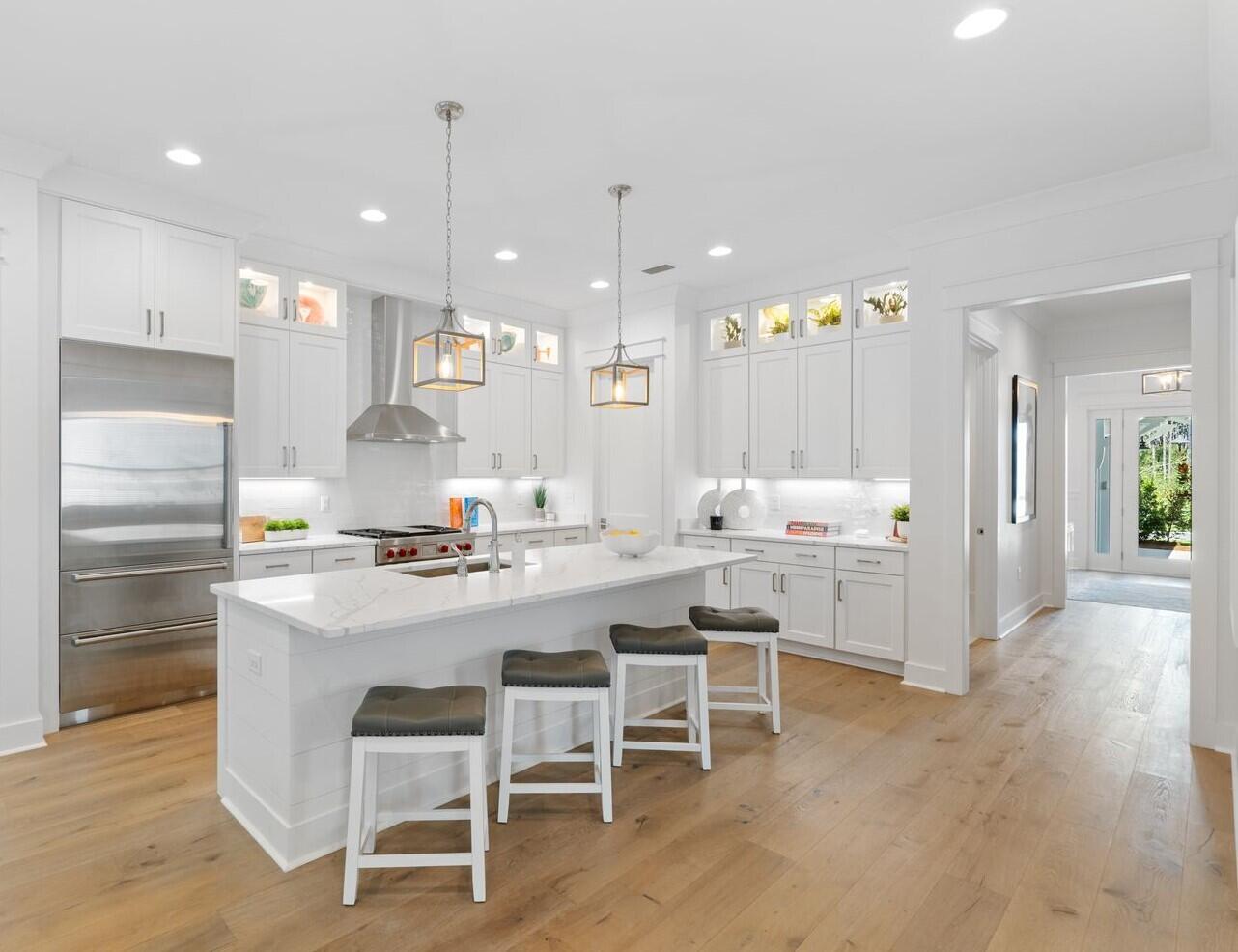 117 Rosecourt St Inlet Beach Inlet Beach, FL 32461 - Photo 20 of 62 a kitchen with white cabinets and chairs
