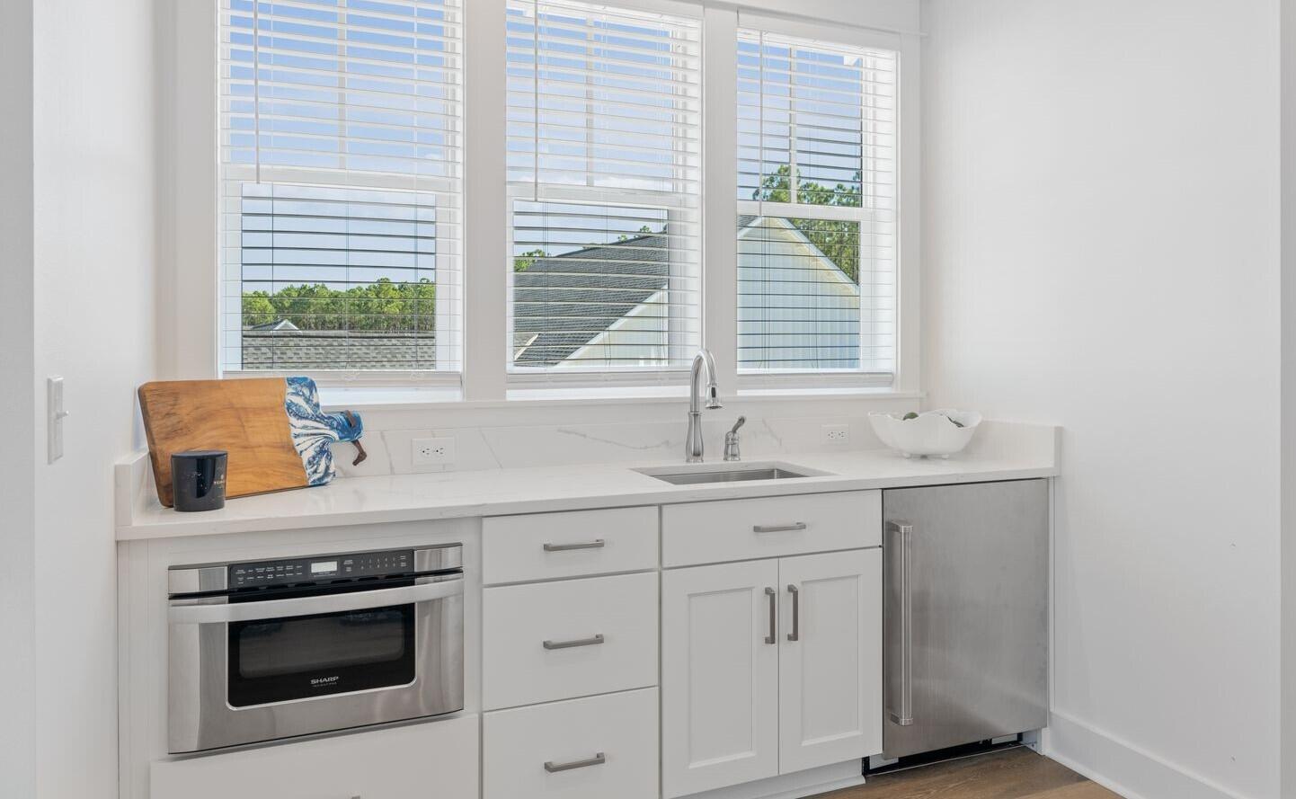117 Rosecourt St Inlet Beach Inlet Beach, FL 32461 - Photo 36 of 62 a kitchen with white cabinets and a sink
