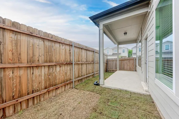 a house view with a backyard space