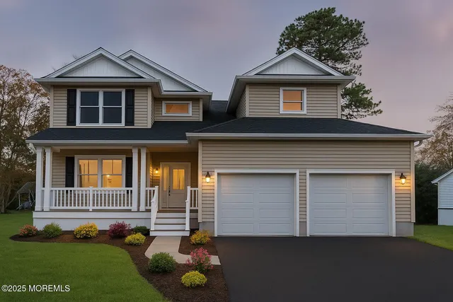 a front view of a house with a garden and plants