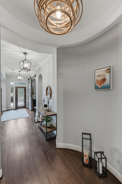 5425 Cherokee Draw Road Austin, TX 78738 - Photo 34 of 40 A graceful entry hall boasts rich hardwood flooring and distinctive arched doorways.