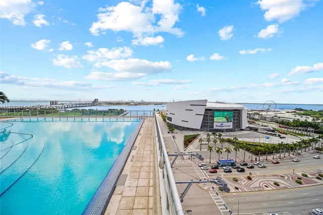 a view of a swimming pool with seating space