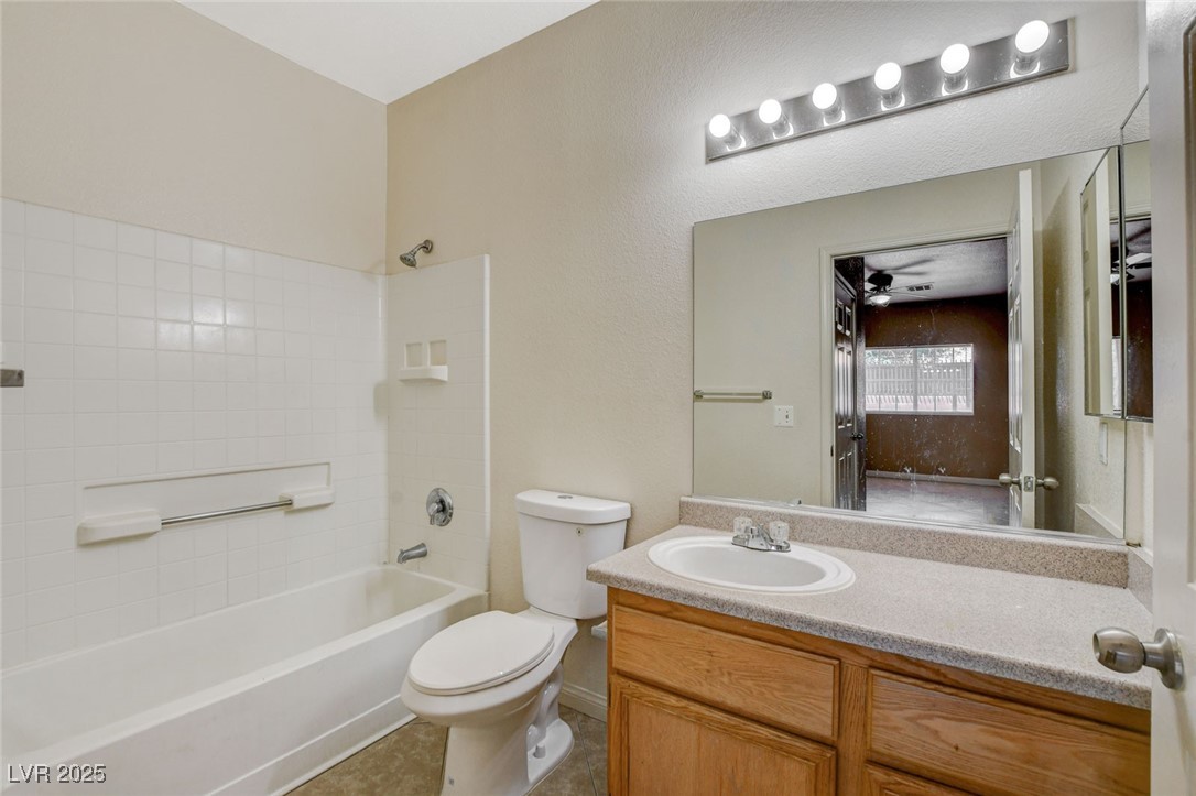 4730 East Craig Road, Unit 1005 Las Vegas, NV 89115 - Photo 30 of 45 Full bath with bathing tub / shower combination, vanity, and tile patterned floors