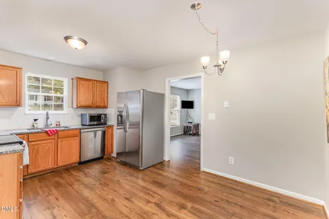 a kitchen with stainless steel appliances a refrigerator and a sink