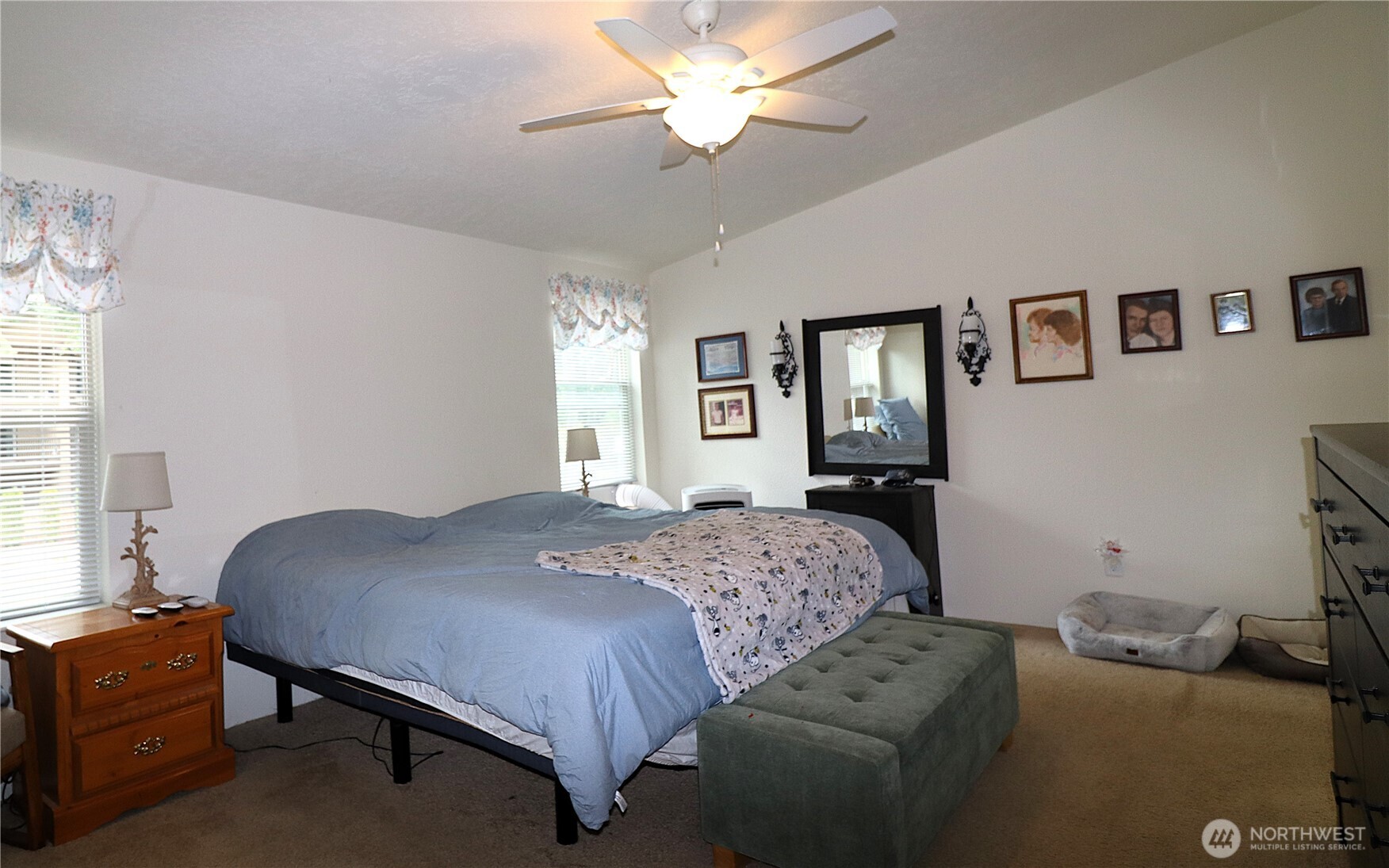 1111 Archwood Drive Southwest, Unit 285 Olympia, WA 98502 - Photo 15 of 17 a bedroom with a bed and a chandelier