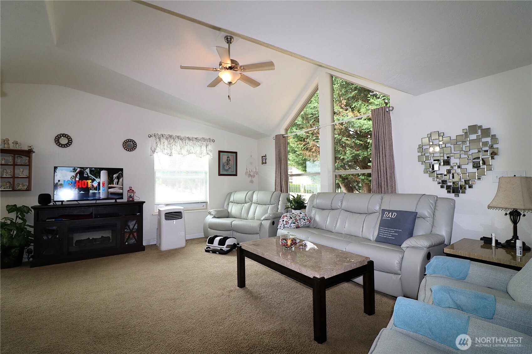 1111 Archwood Drive Southwest, Unit 285 Olympia, WA 98502 - Photo 9 of 17 a living room with furniture and a flat screen tv
