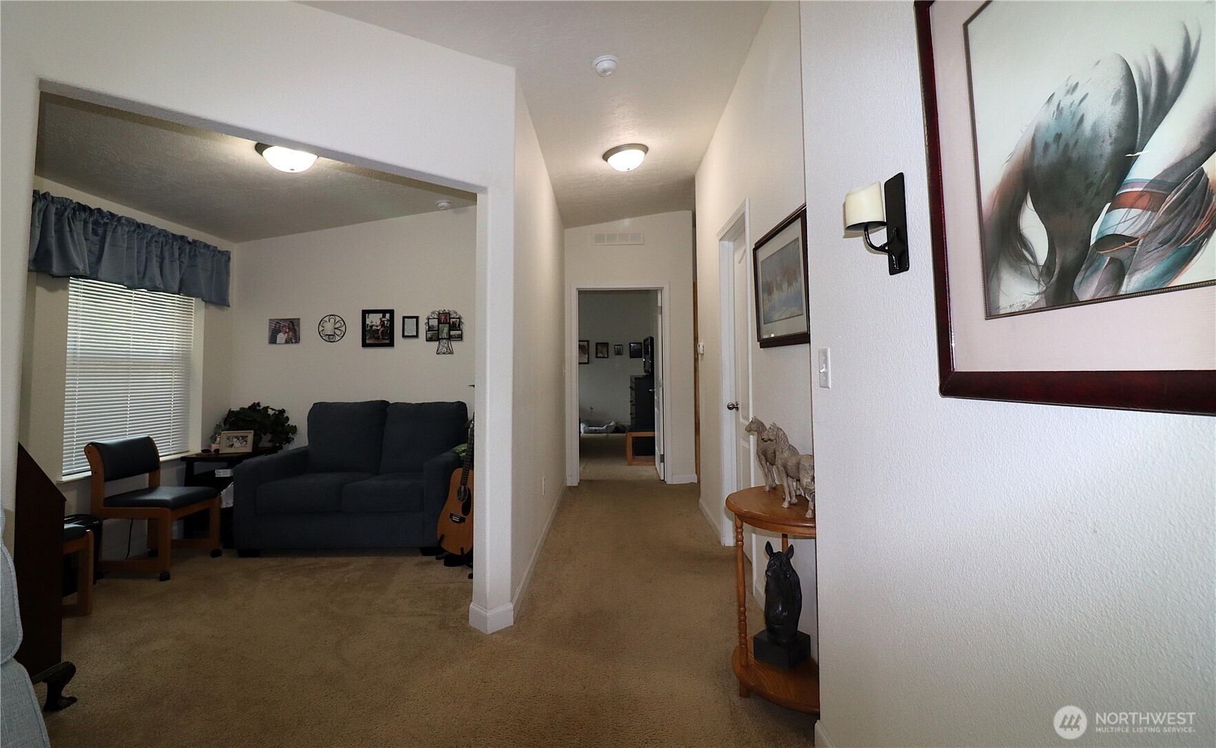 1111 Archwood Drive Southwest, Unit 285 Olympia, WA 98502 - Photo 10 of 17 a living room with furniture and a gym machine