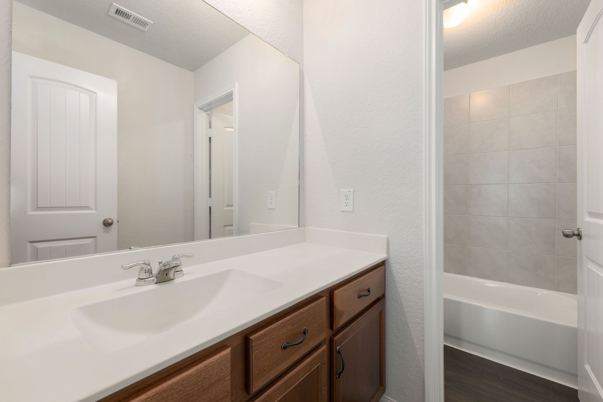 17555 Greystanes Road Humble, TX 77346 - Photo 19 of 28 a bathroom with a sink and a bathtub