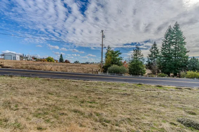 a view of swimming pool with seating space