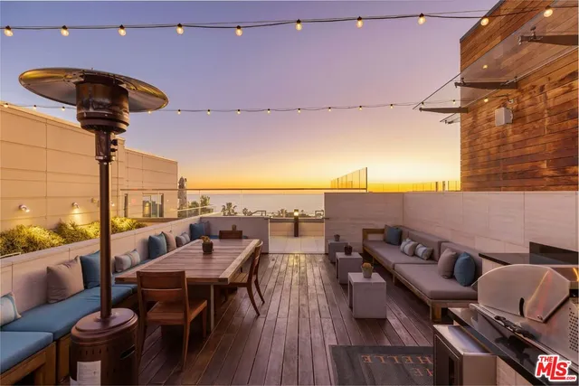 a view of a terrace with furniture and a table