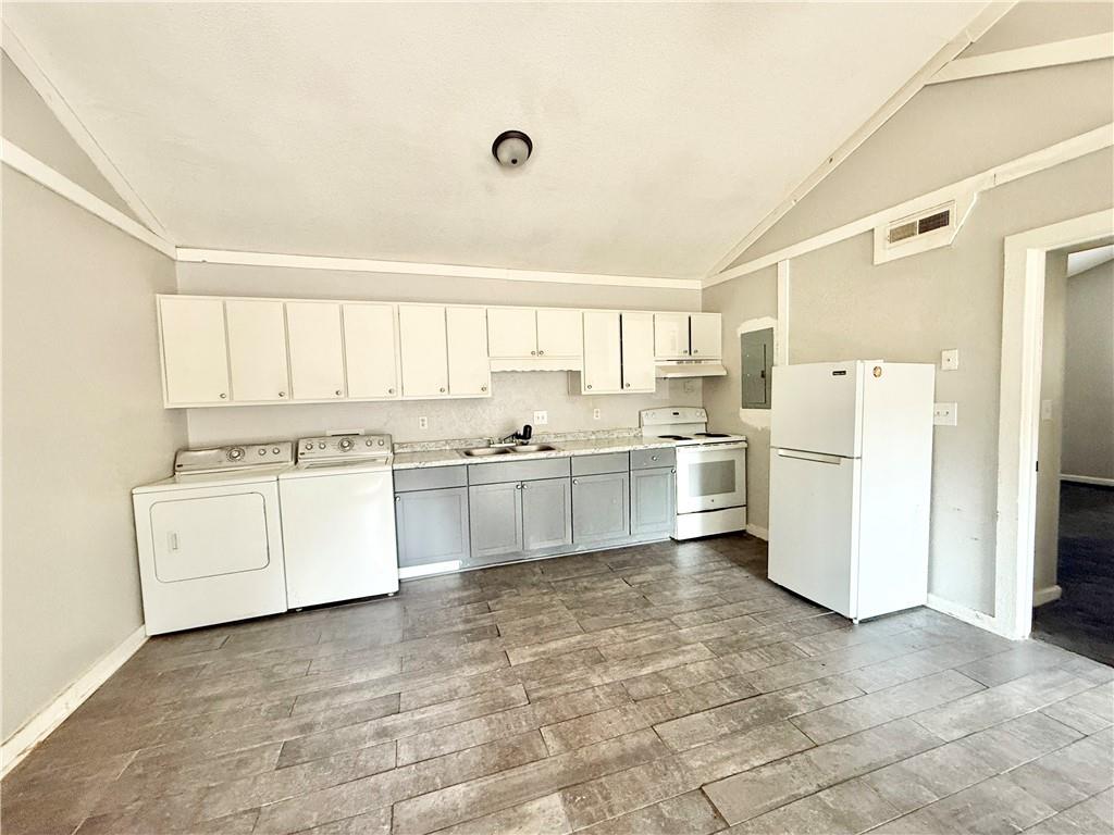 4701 Flat Shoals Road, Unit 2B Union City, GA 30291 - Photo 5 of 14 a kitchen with white cabinets and white appliances