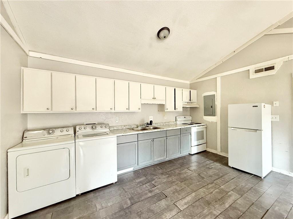 4701 Flat Shoals Road, Unit 2B Union City, GA 30291 - Photo 6 of 14 a kitchen with white cabinets and white appliances
