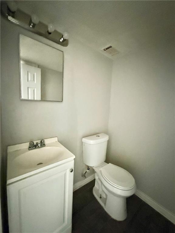 4701 Flat Shoals Road, Unit 2B Union City, GA 30291 - Photo 10 of 14 a white toilet sitting next to a bathroom sink