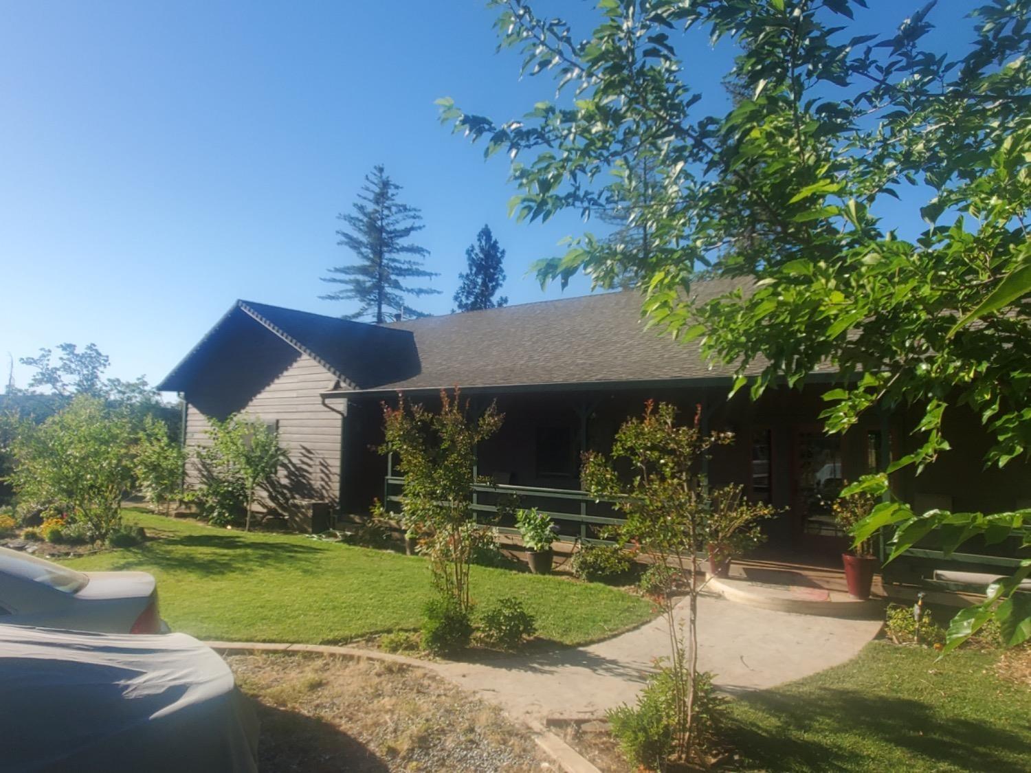 9080 El Dorado Trail Mountain Ranch, CA 95246 - Photo 2 of 44 a front view of a house with a yard