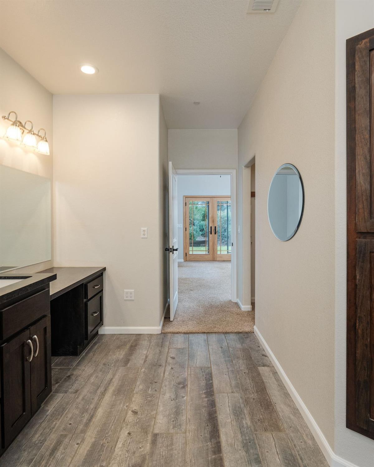 9080 El Dorado Trail Mountain Ranch, CA 95246 - Photo 24 of 44 wooden floor in an empty room