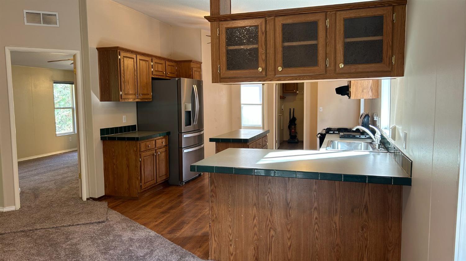 9080 El Dorado Trail Mountain Ranch, CA 95246 - Photo 35 of 44 a kitchen with stainless steel appliances granite countertop a refrigerator and a stove