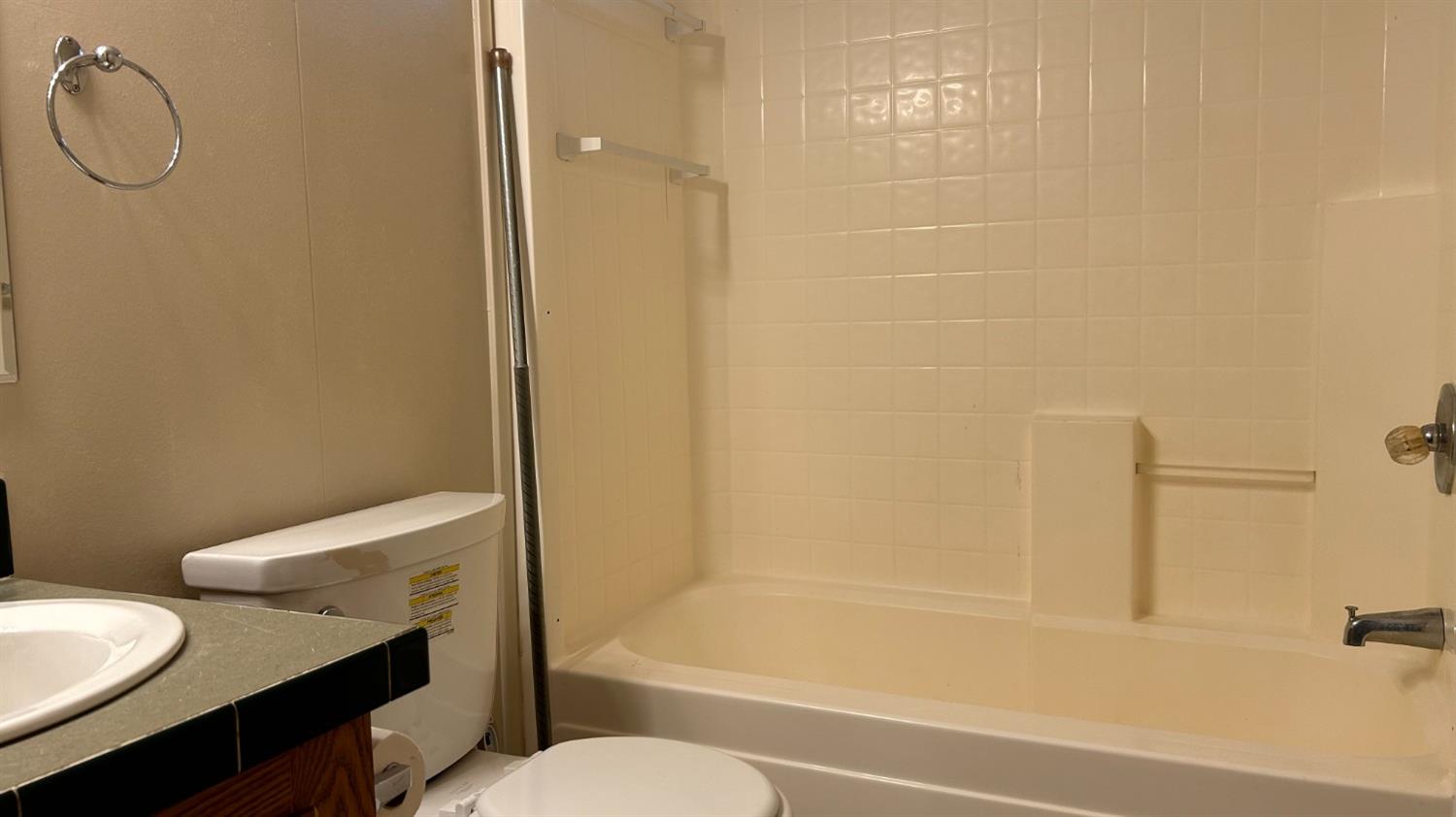 9080 El Dorado Trail Mountain Ranch, CA 95246 - Photo 40 of 44 a bathroom with a granite countertop bathtub shower sink vanity and toilet
