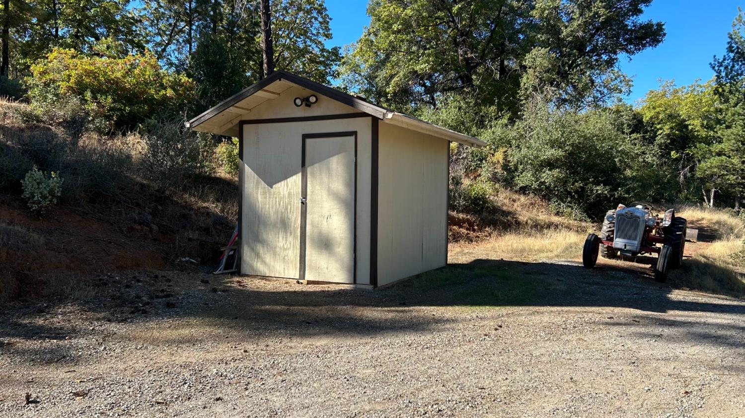 9080 El Dorado Trail Mountain Ranch, CA 95246 - Photo 43 of 44 a front view of a house with a yard