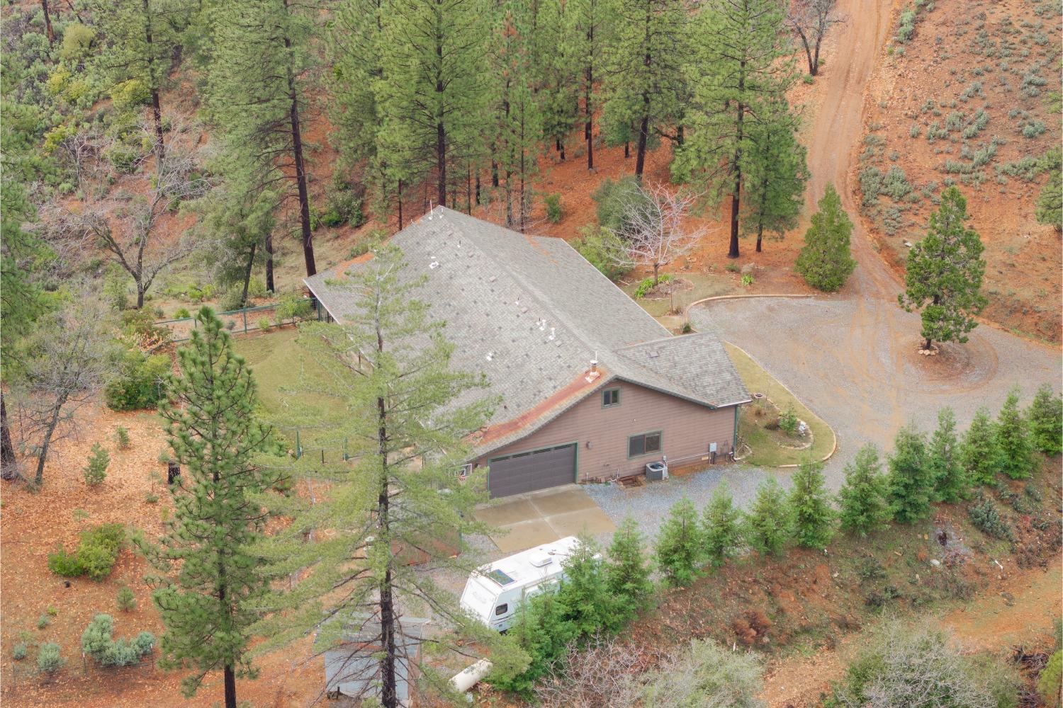 9080 El Dorado Trail Mountain Ranch, CA 95246 - Photo 6 of 44 a view of a house with a yard