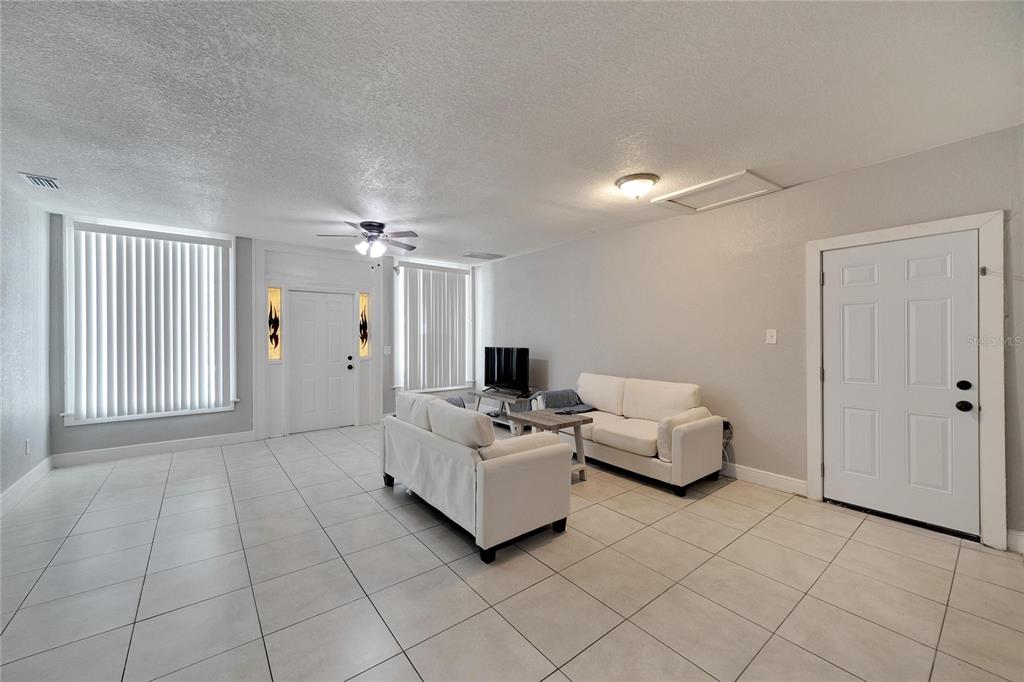 3651 Haines Road North St. Petersburg, FL 33704 - Photo 14 of 35 a living room with furniture and a flat screen tv