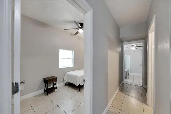 a bedroom with a bed and a chair