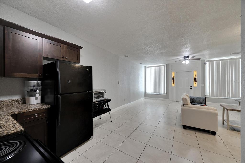 3651 Haines Road North St. Petersburg, FL 33704 - Photo 21 of 35 a kitchen with stainless steel appliances granite countertop a refrigerator and a sink