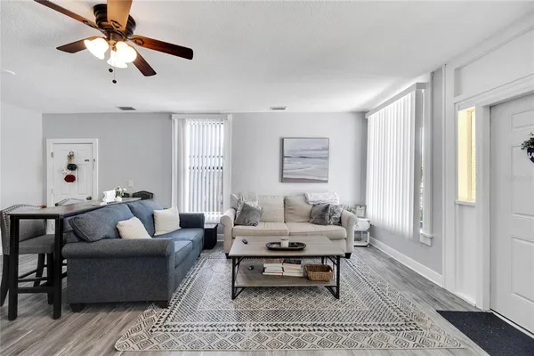 a living room with furniture and a window