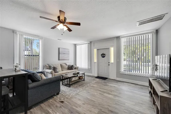 a view of a dining room with furniture and wooden floor