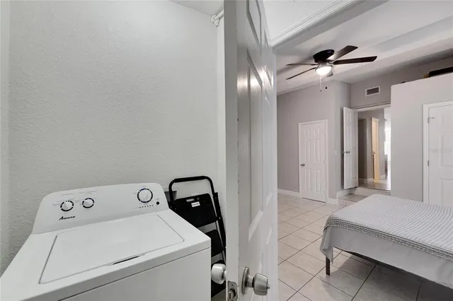a view of storage and utility room with washer and dryer