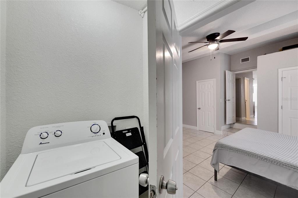 3651 Haines Road North St. Petersburg, FL 33704 - Photo 34 of 35 a view of storage and utility room with washer and dryer