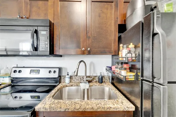 a kitchen with a stove and a microwave