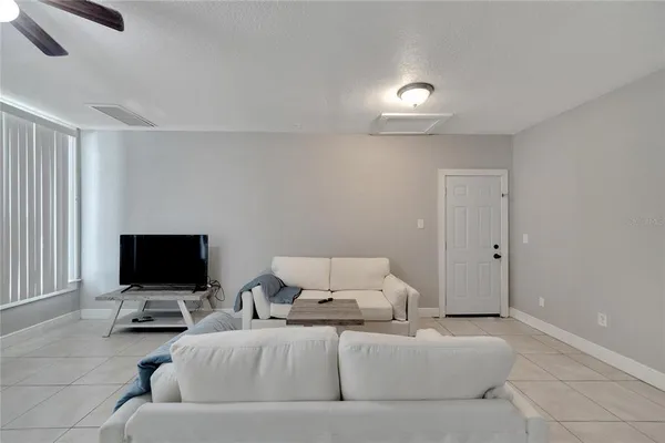 a kitchen with cabinets and refrigerator