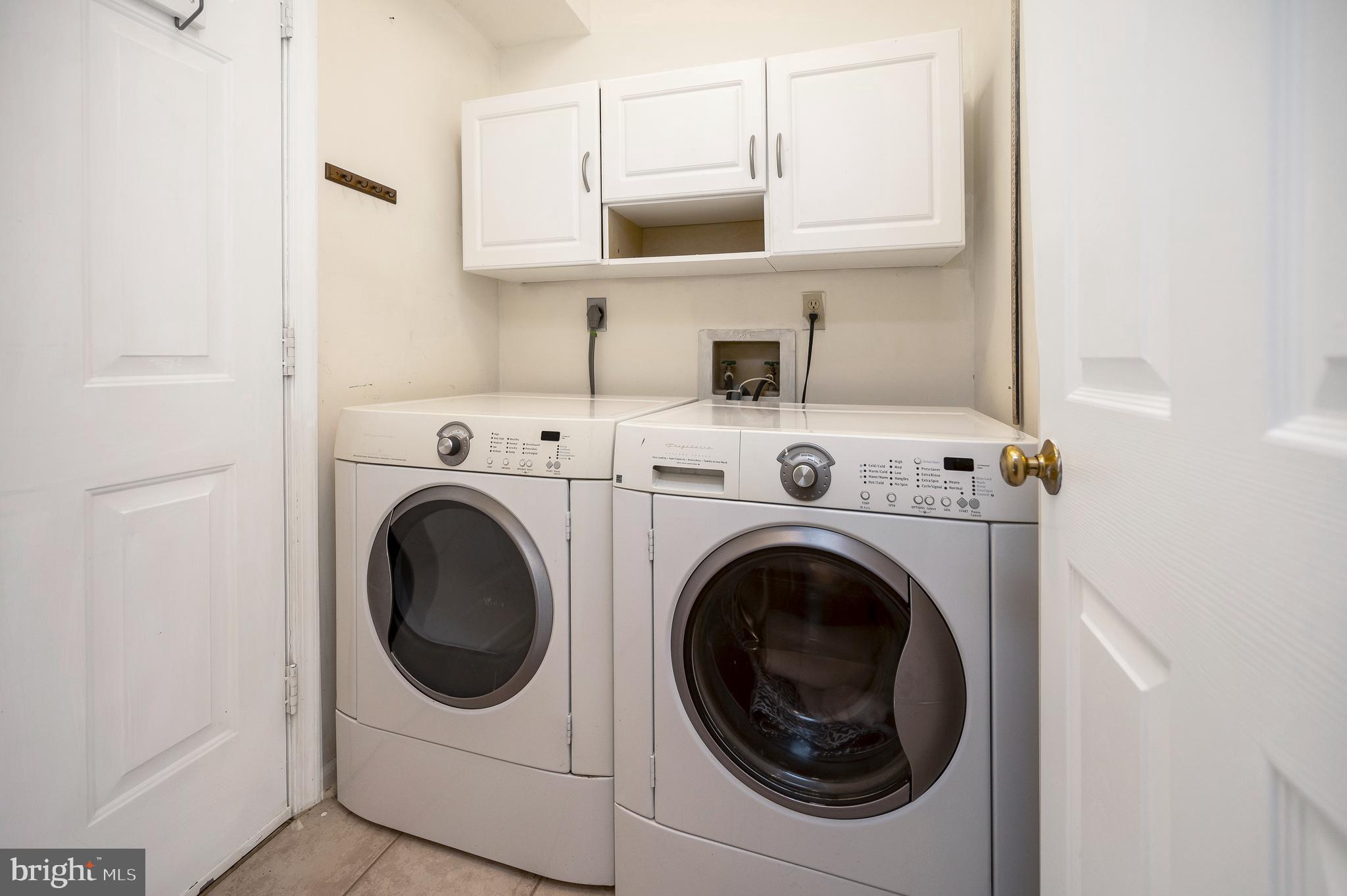 2005 Lakeview Parkway Locust Grove, VA 22508 - Photo 16 of 52 Front loading washer & dryer with cabinets.