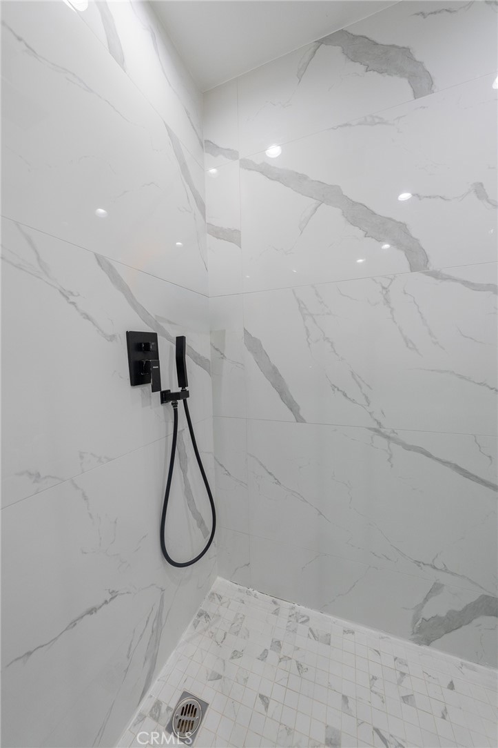 7719 Rhodes Avenue North Hollywood, CA 91605 - Photo 16 of 16 a bathroom with a shower