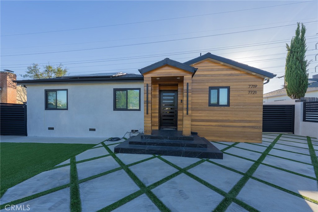 7719 Rhodes Avenue North Hollywood, CA 91605 - Photo 4 of 16 a view of house with backyard and garden