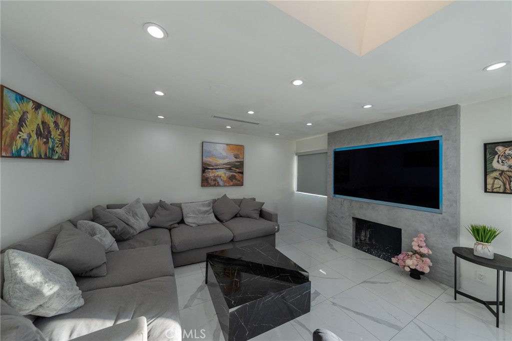 7719 Rhodes Avenue North Hollywood, CA 91605 - Photo 6 of 16 a living room with furniture and a flat screen tv