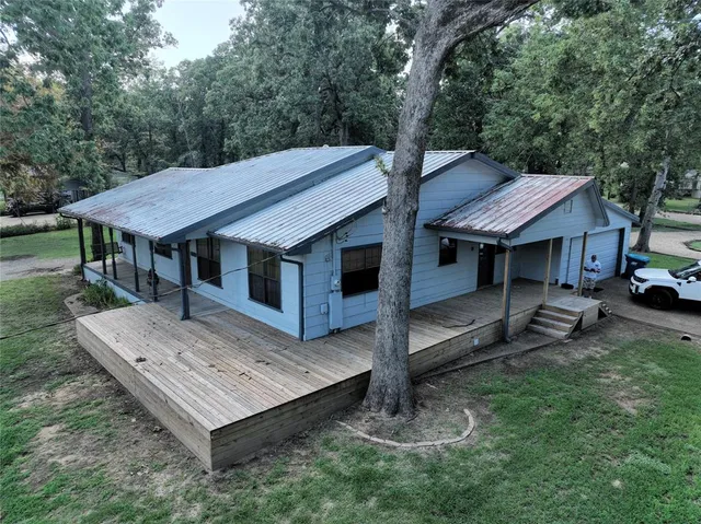 a view of a house with a sink and a backyard