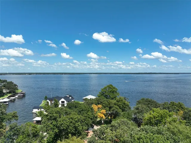 a view of a lake with a yard