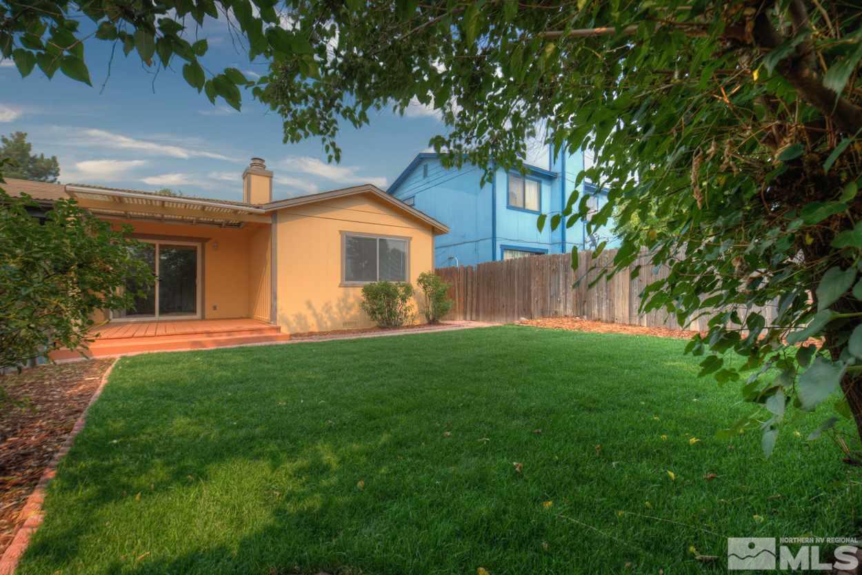 10034 Humite Lane Reno, NV 89506 - Photo 2 of 21 a front view of house with yard and green space