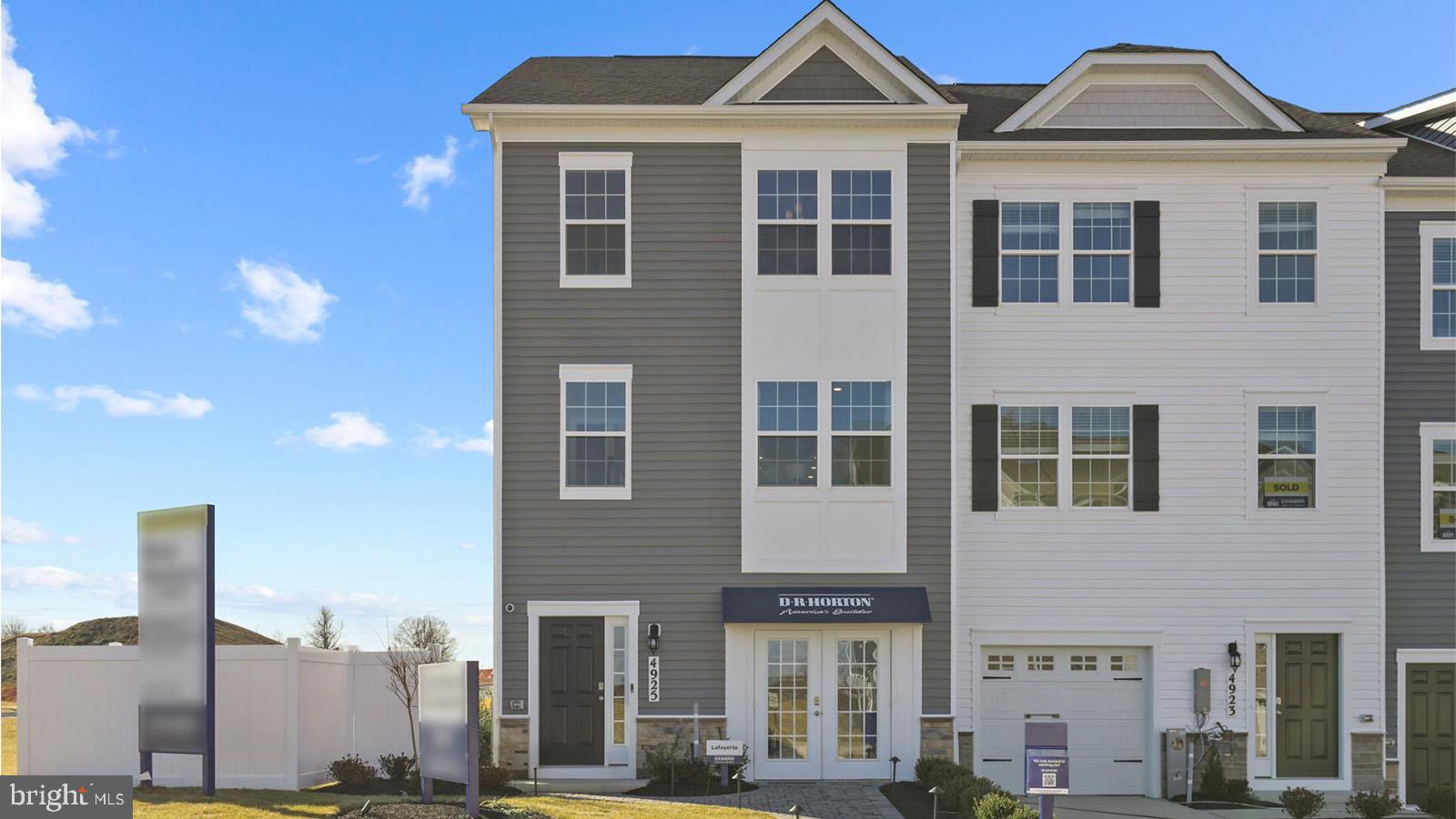 5019 Silver Oak Drive Rosedale, MD 21237 - Photo 1 of 43 a front view of a residential apartment building with a yard