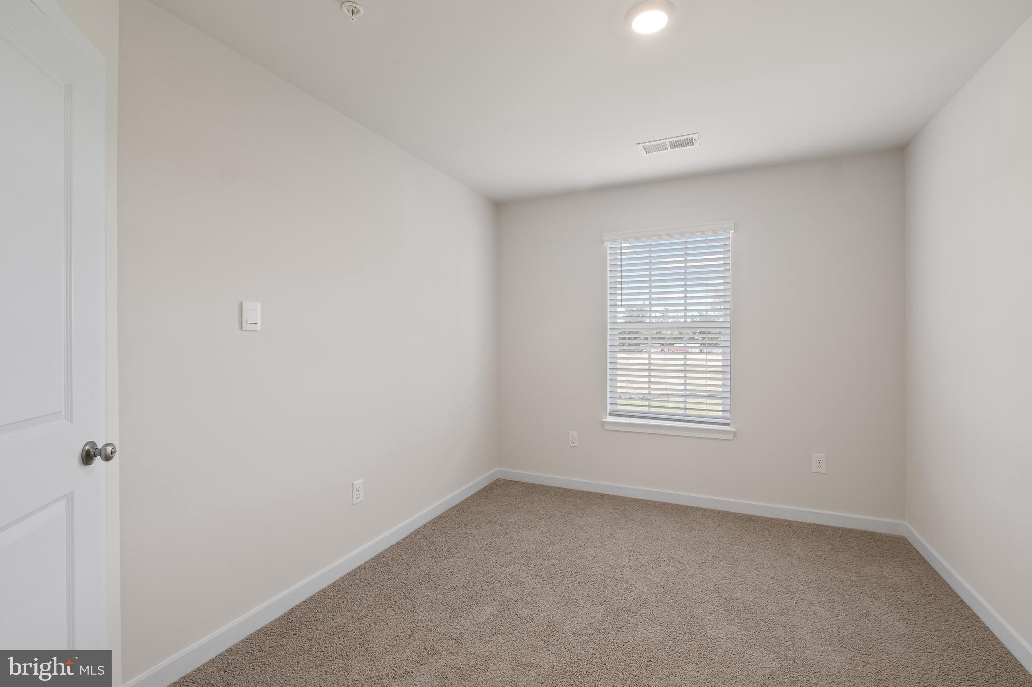 5019 Silver Oak Drive Rosedale, MD 21237 - Photo 22 of 43 a view of an empty room with a window